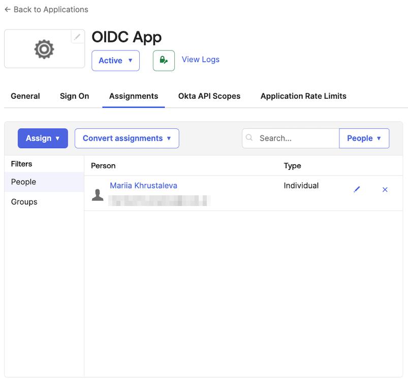 Okta admin dashboard screen showing a user being added to the list with users and groups assigned to the OIDC-based application